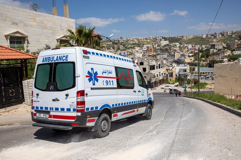 An ambulance drives through Jerash, in Jordan.  EPA