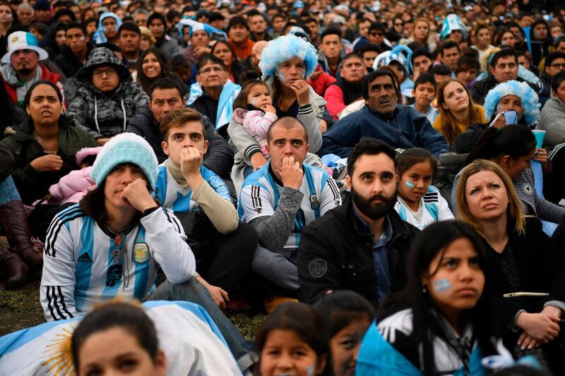 Fans of Argentina watch the FIFA World Cup Russia 2018 match between Argentina and Nigeria on a giant screen at San Martin square in Buenos Aires. AFP