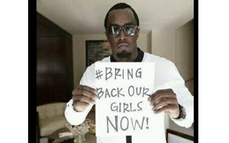 Sean Combs aka Puff Daddy holds up a #BringBackOurGirlsNow sign. Courtesy Sean Combs