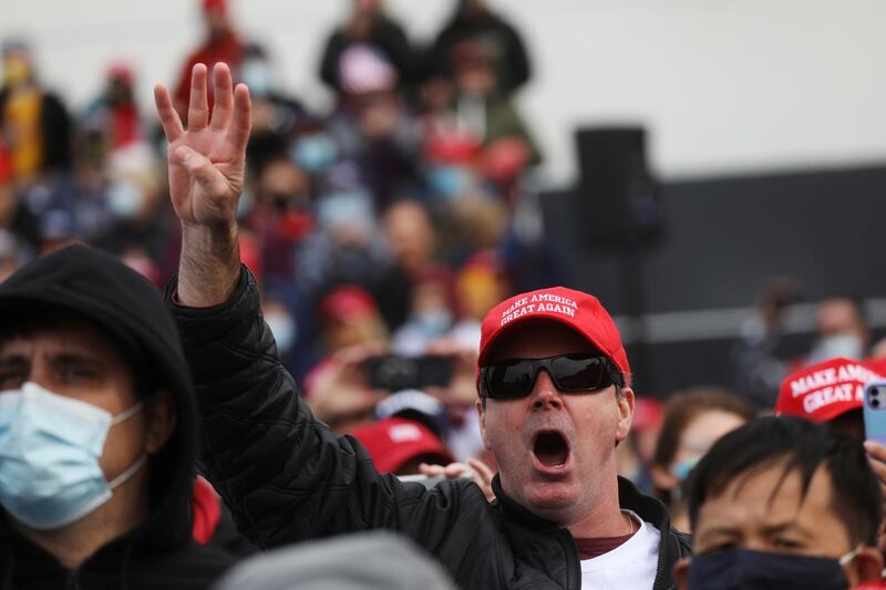 A man gestures as U.S. President Donald Trump holds a campaign rally in Londonderry, New Hampshire, U.S.Reuters