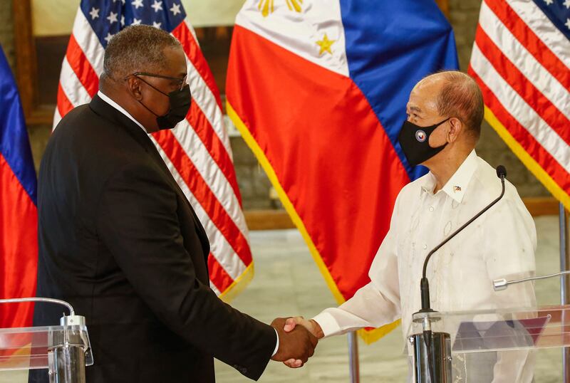 US Defence Secretary Lloyd Austin and Philippines Defence Secretary Delfin Lorenzana after a meeting in Manila. AFP