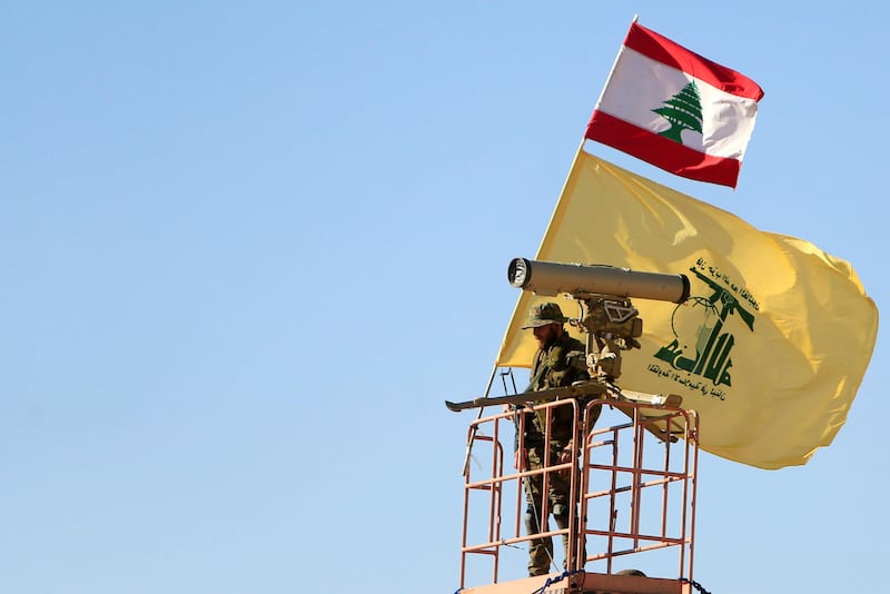 A Hezbollah fighter stands at a watch tower at Juroud Arsal, the Syria-Lebanon border. Ali Hashisho