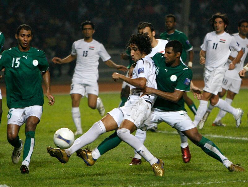 Iraq's Karrar Jassim Mohammed, centre, is surrounded by Saudi Arabia defenders. Reuters