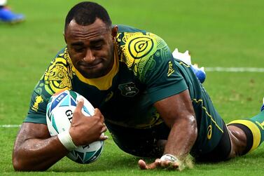 Tevita Kuridrani dives over for a try as Australia overcame a slow start to beat Uruguay 45-10. AFP