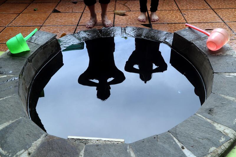 An Indonesian couple pray at the Gayatri temple in Cilodong, West Java. EPA