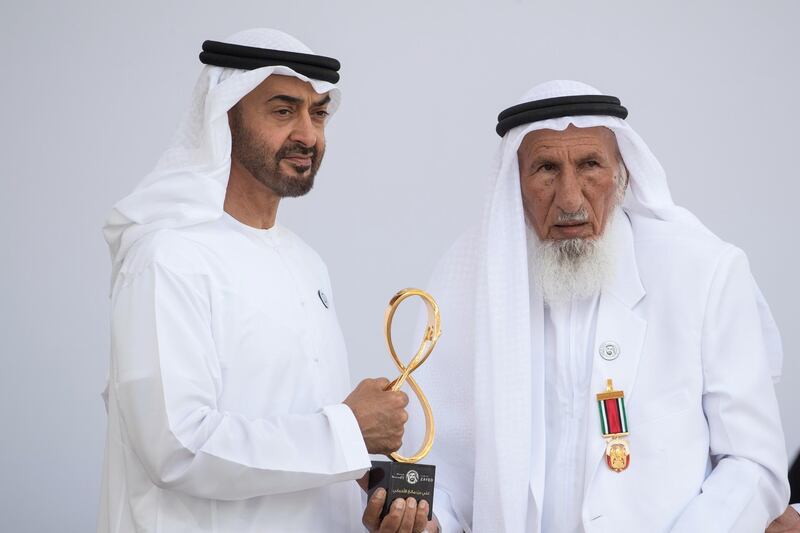 ABU DHABI, UNITED ARAB EMIRATES -  March 12, 2018: HH Sheikh Mohamed bin Zayed Al Nahyan, Crown Prince of Abu Dhabi and Deputy Supreme Commander of the UAE Armed Forces (L), presents an Abu Dhabi Award to Ali bin Manea Al Ahbabi (R), during the awards ceremony at the Sea Palace.
( Ryan Carter for the Crown Prince Court - Abu Dhabi )
---