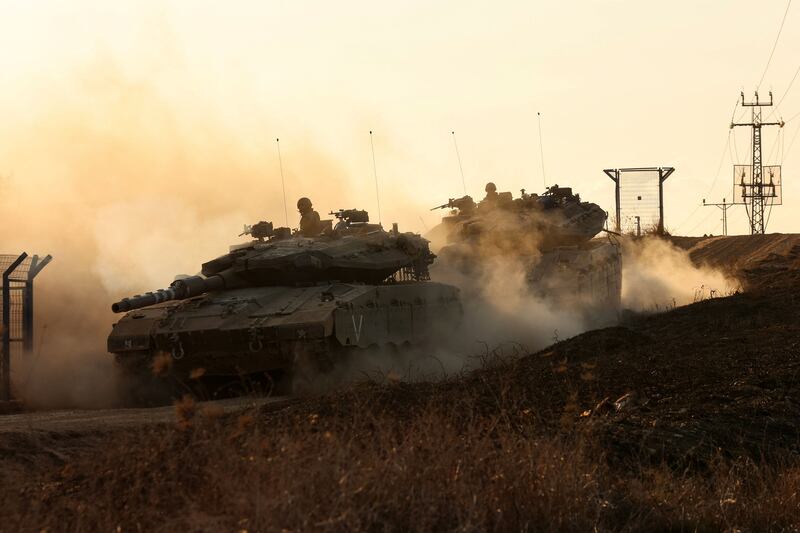 Israeli tanks at an undisclosed location along the border with Gaza on Wednesday. AFP