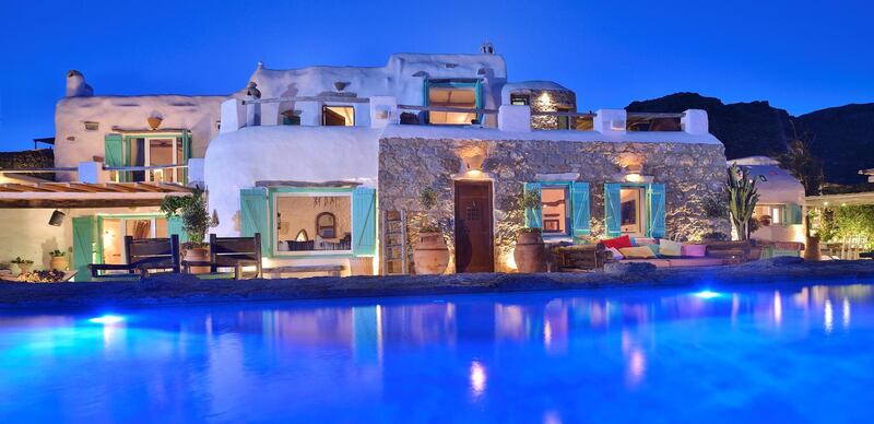 Residence MK0417, listed by Algean Property in Lia Bay, Mykonos, has a blue and white facade  