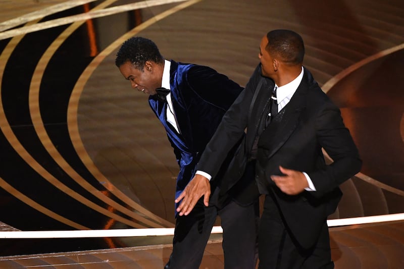 In an unexpected moment at the 2022 Academy Awards, actor Will Smith slaps comedian Chris Rock. AFP