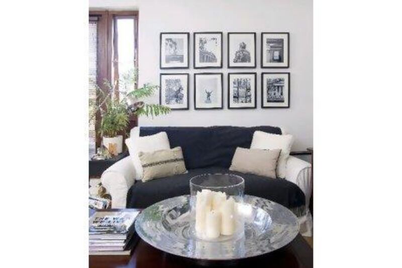 The warm wood coffee table with silver center piece in front of the sofa helps to add warmth to the livingroom.
Photo: Eamon McAfee