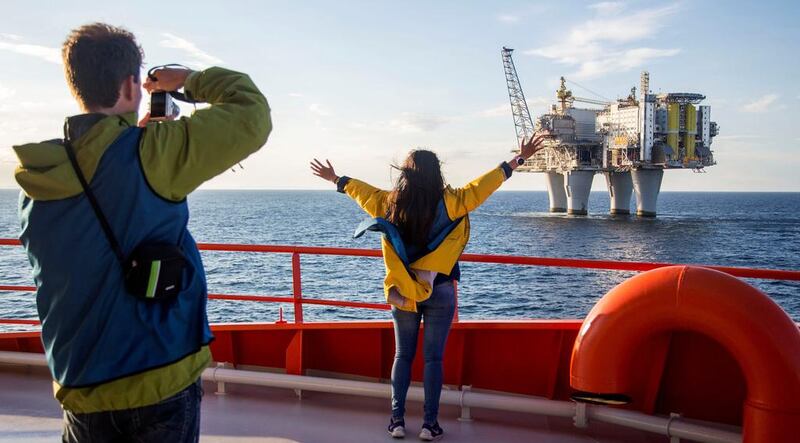 People observe an oil platform during their recent oil-platform viewing cruise on the Edda Fides in the North Sea off Norway. Thomas Mortveit / Reuters