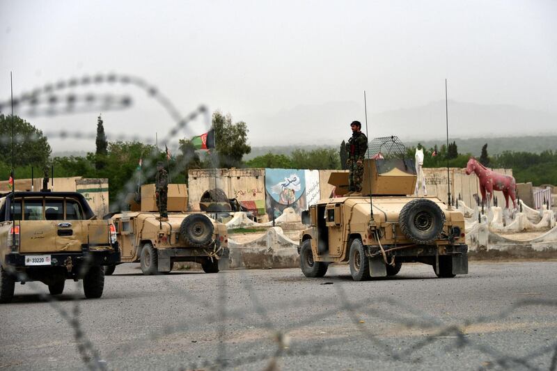 Afghan security forces stand on Humvee vehicles during a military operation in Arghandab district of Kandahar province on April 4, 2021. / AFP / JAVED TANVEER
