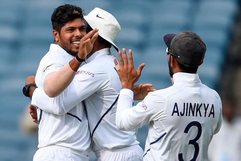 India's Umesh Yadav (L) celebrates with teammates after dismissing South Africa's Aiden Markram on the second day of the second Test cricket match between India and South Africa at the Maharashtra Cricket Association Stadium in Pune on October 11, 2019. IMAGE RESTRICTED TO EDITORIAL USE - STRICTLY NO COMMERCIAL USE
 / AFP / PUNIT PARANJPE / IMAGE RESTRICTED TO EDITORIAL USE - STRICTLY NO COMMERCIAL USE
