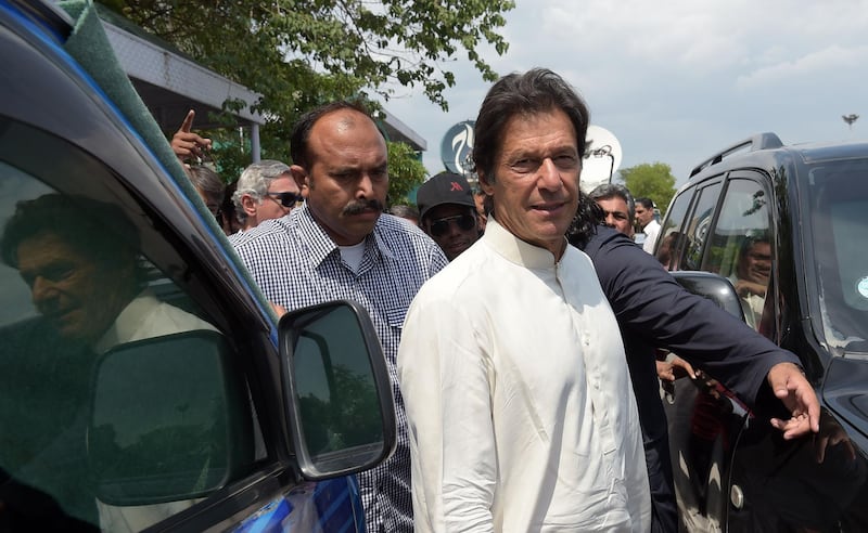 Pakistani opposition leader and head of the Pakistan Tehreek-i-Insaf (PTI) party Imran Khan leaves the Supreme Court after attending a hearing on the Panama Papers case in Islamabad on May 22, 2017.
A Pakistani opposition party led by former cricketer Imran Khan will take legal action against the government for detaining its vocal online activists under a controversial cybercrime law, a spokesman said. At least 23 supporters of the Pakistan Tehreek Insaaf (Movement for Justice) party have been detained and threatened with action under the Prevention of Electronic Crime Act, Fawad Hussain Chauhdry, a spokesman for the party, told AFP. It is the first time the new law has been used in a broad crackdown against political opposition. / AFP PHOTO / AAMIR QURESHI