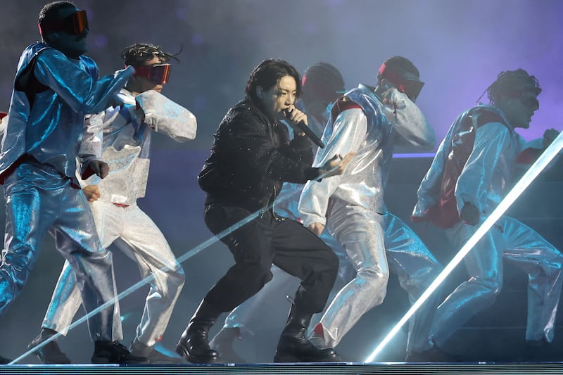 South Korean singer Jung Kook, centre, performs. AFP