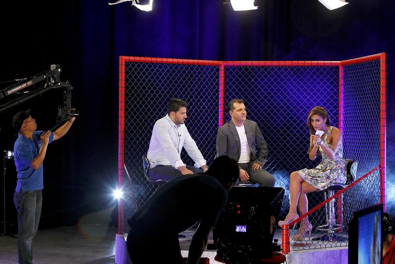 From left, co-hosts Ali Mokdad, Rio Altaie and Jory Bakr of MMA All Out, the UAE programme on the Physique television channel centred on mixed martial arts. Jeffrey E Biteng / The National


