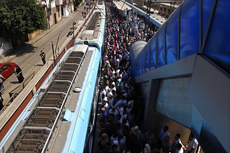 Egyptians wait on the platform to board at Sayeda Zeinab metro station in Cairo.