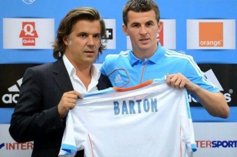 Joey Barton, left, with Vincent Labrune, the Marseille president, joined the club on a season long loan.