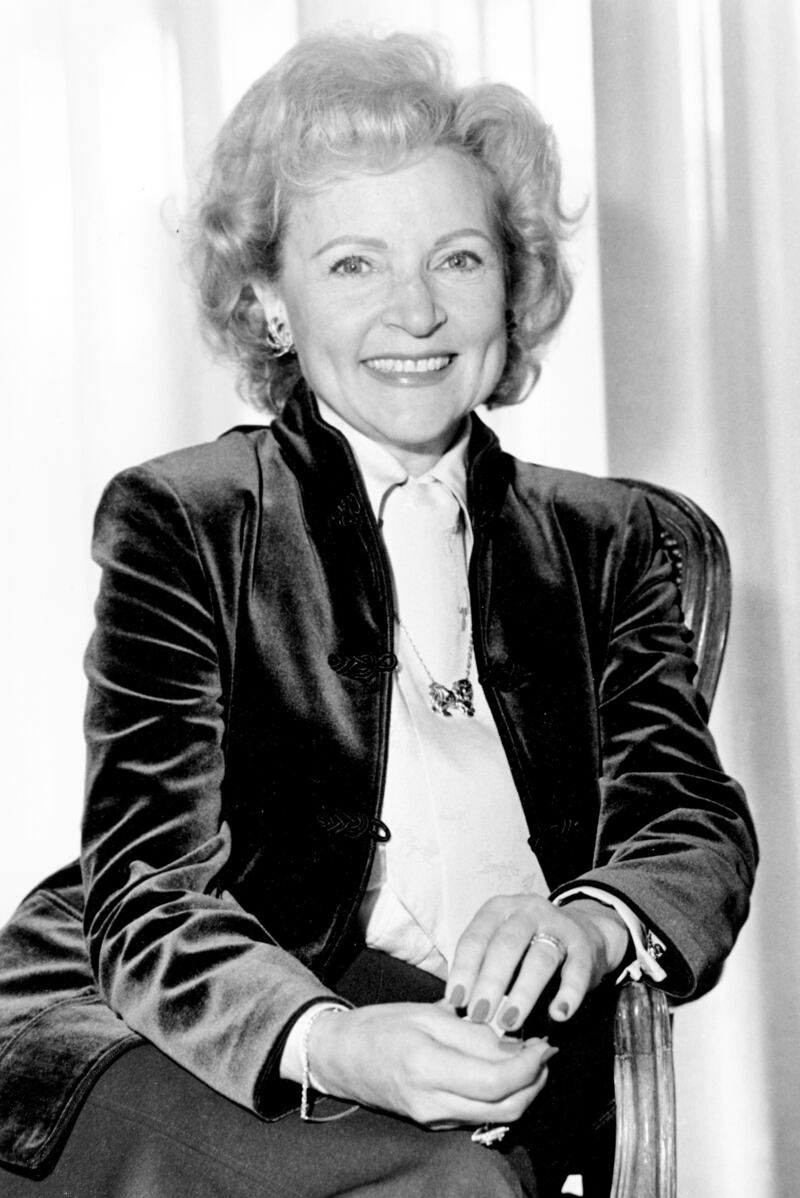 Betty White, in a velvet jacket, white shirt and rose necklace, poses for a portrait in Los Angeles on March 5, 1982. AP