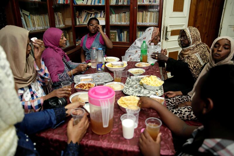 Sudanese women gather to eat an iftar meal during Ramadan at El-Sudan home in Cairo, Egypt. Reuters