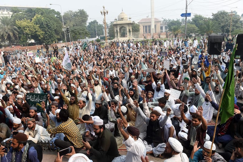 Supporters of Tehreek-e-Labaik Pakistan political party chant slogans during a protest against the court decision. AFP