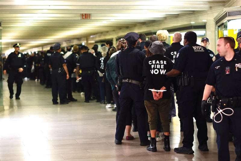 NYPD officers arrest protesters during a demonstration calling for a ceasefire amid war between Israel and Hamas, at Grand Central Station in New York City. AFP