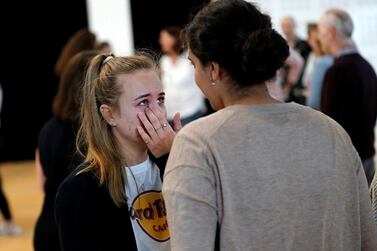 A student gets emotional after receiving her A-level exam results in Birmingham, UK. Reuters