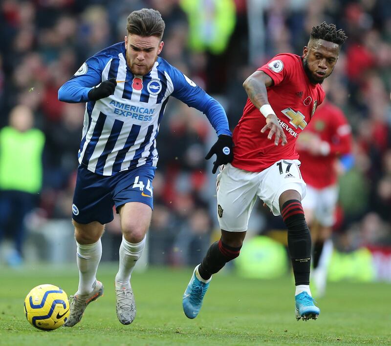 Manchester United's Fred, right, vies for the ball with Brighton Hove Albion's Aaron Connolly during the their match at Old Trafford on Sunday. EPA