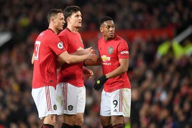 MANCHESTER, ENGLAND - MARCH 08: Nemanja Matic of Manchester United , Harry Maguire of Manchester United and Anthony Martial of Manchester United look on during the Premier League match between Manchester United and Manchester City at Old Trafford on March 08, 2020 in Manchester, United Kingdom. (Photo by Michael Regan/Getty Images)