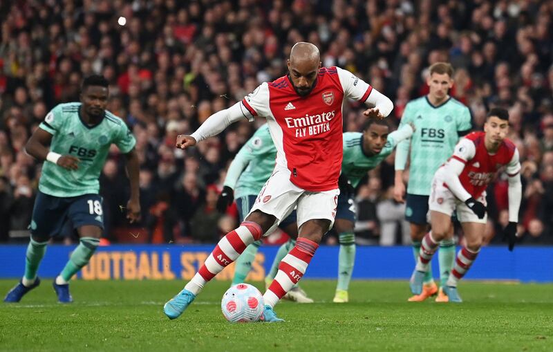 Lacazette scores from the penalty spot. AFP