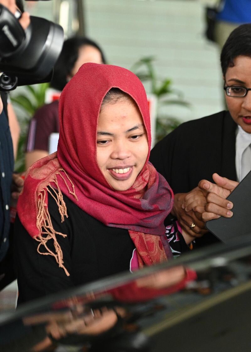 Indonesian national Siti Aisyah smiles while leaving the Shah Alam High Court, outside Kuala Lumpur on March 11, 2019 after her trial for her alleged role in the assassination of Kim Jong Nam, the half-brother of North Korean leader Kim Jong Un. An Indonesian woman accused of assassinating the North Korean leader's half-brother was to be freed March 11 after a prosecutor withdrew a murder charge against her, a judge said.  / AFP / Mohd RASFAN
