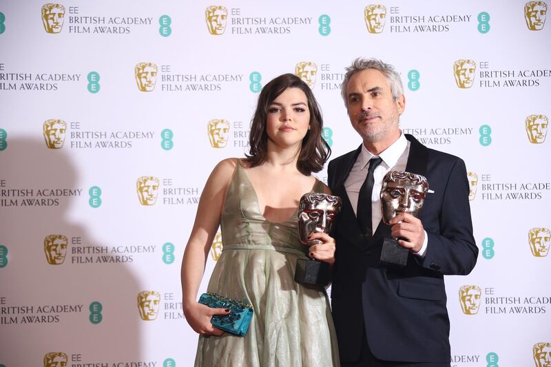 Director Alfonso Cuaron poses with his daughter, Tess Bu Cuaron, with his Best Film and Best Director awards. AP