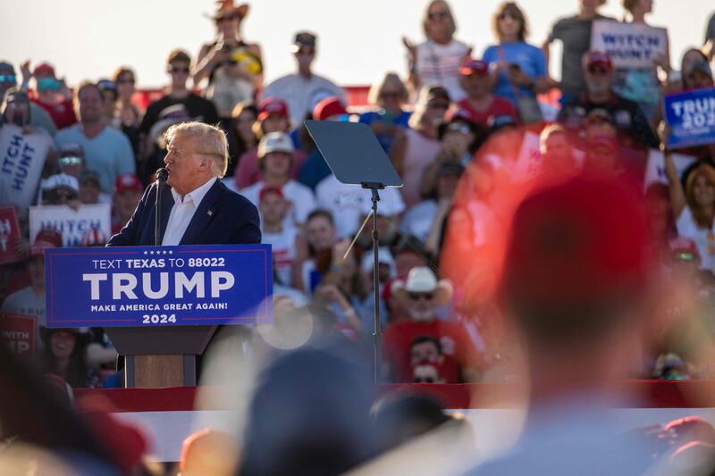 Mr Trump at the podium. Getty