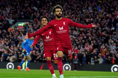 Liverpool's Mohamed Salah celebrates after scoring his side's opening goal during the English Premier League soccer match between Liverpool and Manchester City at Anfield stadium in Liverpool, Sunday, Oct.  16, 2022.  
 (Peter Byrne / PA via AP)
