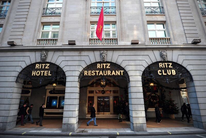 (FILES) In this file photo taken on December 17, 2012 People walk past the Ritz hotel in central London on December 17, 2012.  Several bids of more than £1 billion ($1.3 billion, 1.2 billion euros) have been received as offers to buy London's Ritz hotel, co-owner Frederick Barclay said on March 4, 2020. / AFP / Carl COURT
