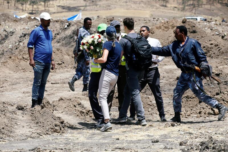 Ethiopian police tries to block an American family from laying flowers for their daughter, who died in the Ethiopian Airlines Flight ET 302 plane crash. Reuters