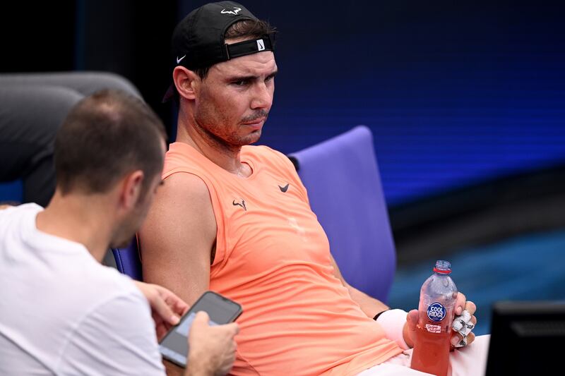 Rafael Nadal rests during a practice session at Sydney Olympic Park Tennis Centre. EPA