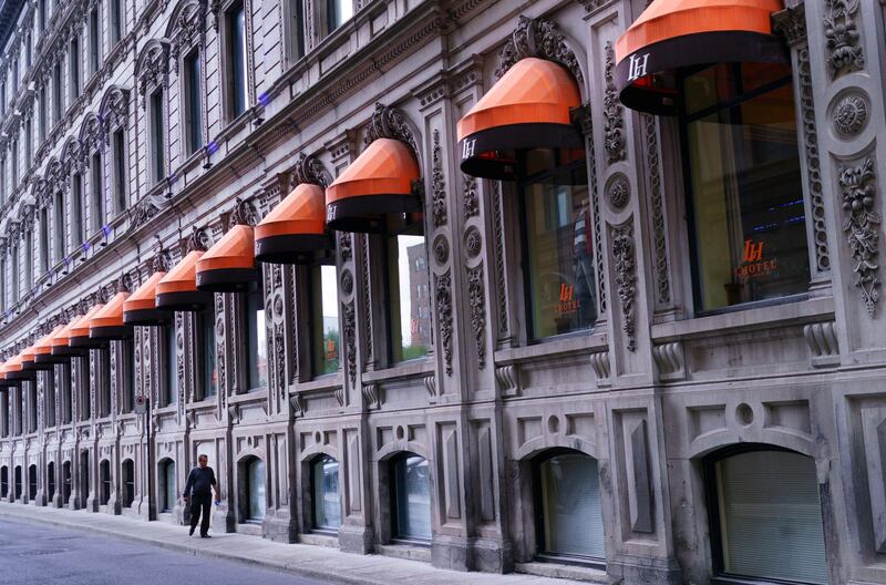 A pedestrian in Old Montreal, on 28 September. Paul Chiasson/The Canadian Press via AP