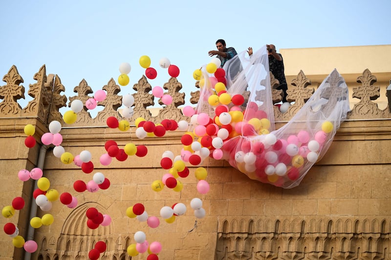 Balloons are released during an Eid Al Adha service at Al Sayeda Zainab Mosque in Cairo. EPA