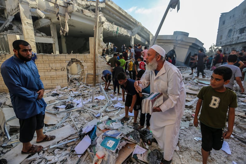 Gazans inspect the Khaled bin Al-Walid Mosque, which was destroyed during Israeli air raids in Khan Younis. Getty Images