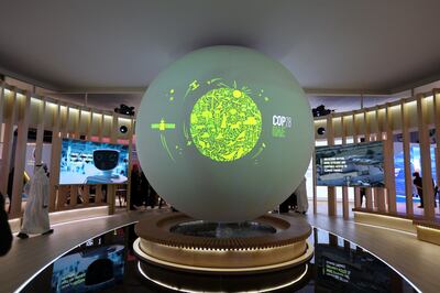 The Cop28 UAE logo on a globe, at Abu Dhabi Sustainability Week in Abu Dhabi, on January 17. Reuters 