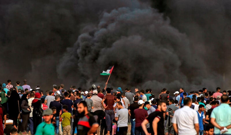 Smoke from a tyre fire rises as Palestinians protest near the border with Israel. AFP