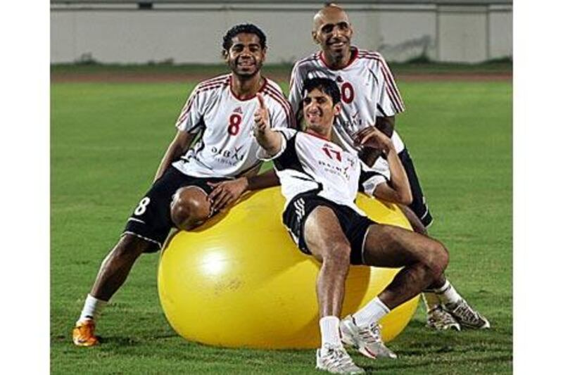 Saleh Obaid, above centre, with his teammates Haider Ali, left, and Hilal Saeed during training for a World Cup qualifier against Syria last June, says a poor diet contributed to the UAE's failure to qualify.