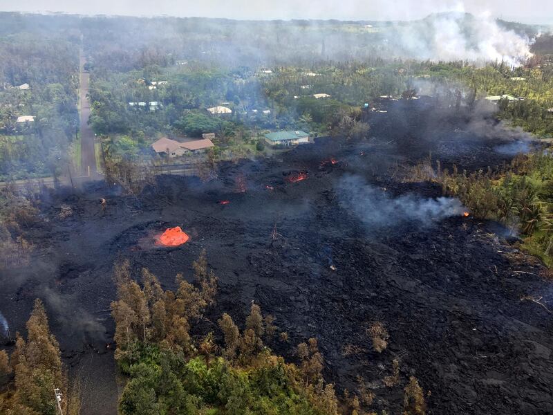 Fissure 7 in Pahoa, Hawaii. At the peak of its activity, large bubble bursts occurred at one spot, lower left, in the fissure while spattering was present in other portions. US Geological Survey via AP