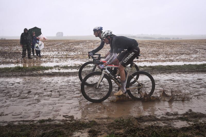 Belgian rider Lawrence Naesen, front, during the Paris-Roubaix one-day classic on Sunday. October 3. AFP