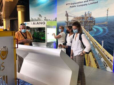 Visitors make their way around the PTTEP stand