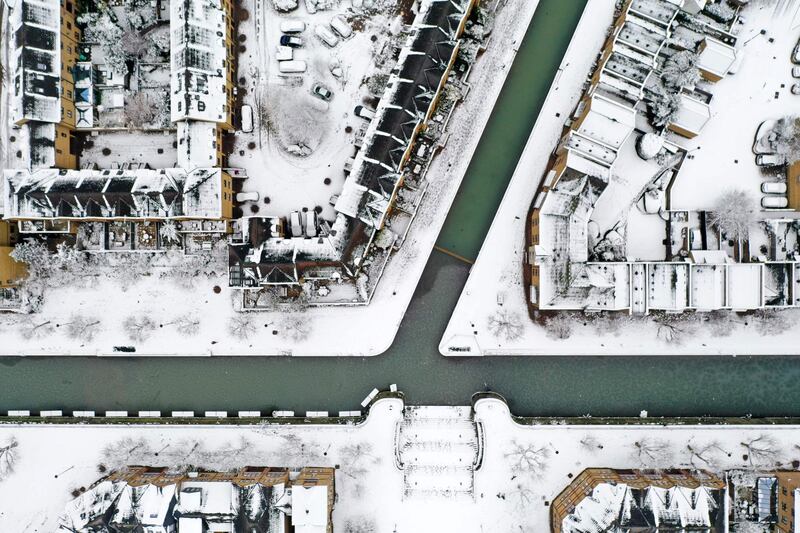 Snow and ice covers the canals and rooftops of Wapping, east London. AFP