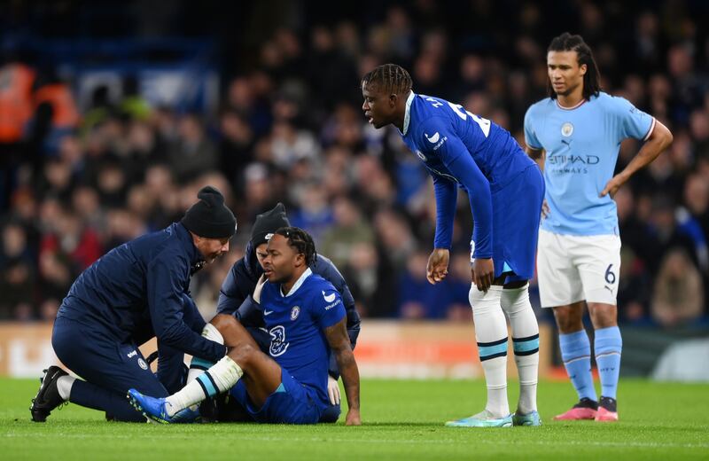 Raheem Sterling of Chelsea receives medical treatment, before leaving the field and being replaced by Pierre-Emerick Aubameyang. Getty 