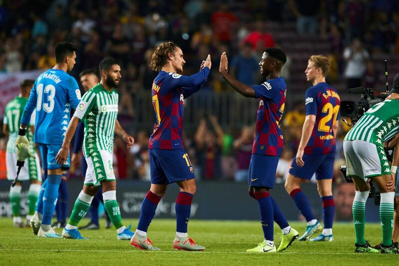 Barcelona's Antoine Griezmann and Ansu Fati celebrate their win over Betis. EPA