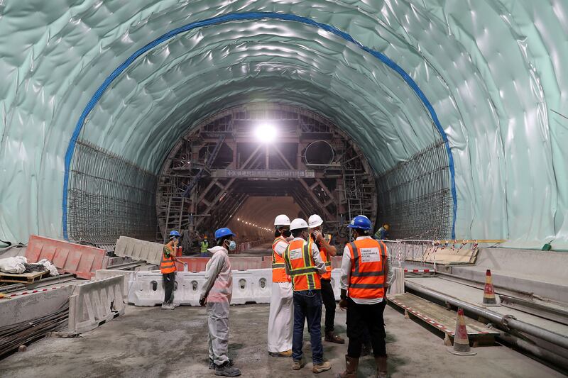 Workers inside the tunnel. It took construction crews more than 300,000 man hours to remove about 500,000 tonnes of rock - an amount similar in weight to all the materials used to build the Burj Khalifa.